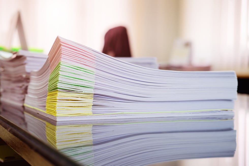 Stack of Organized Papers on a Desk